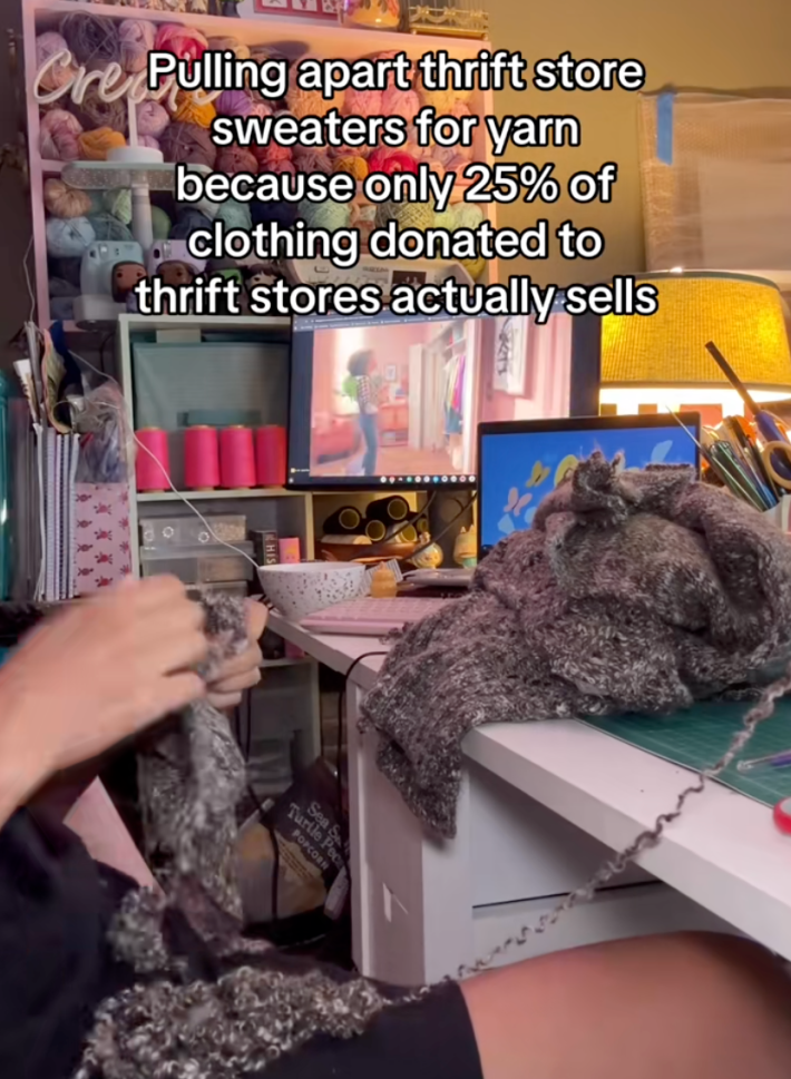 @ourshieldmaiden/TikTok unreaveling sweater to make balls of yarn with text "pulling apart thrift store sweaters for yarn because only 25% of clothing donated to thrift stores actually sells."