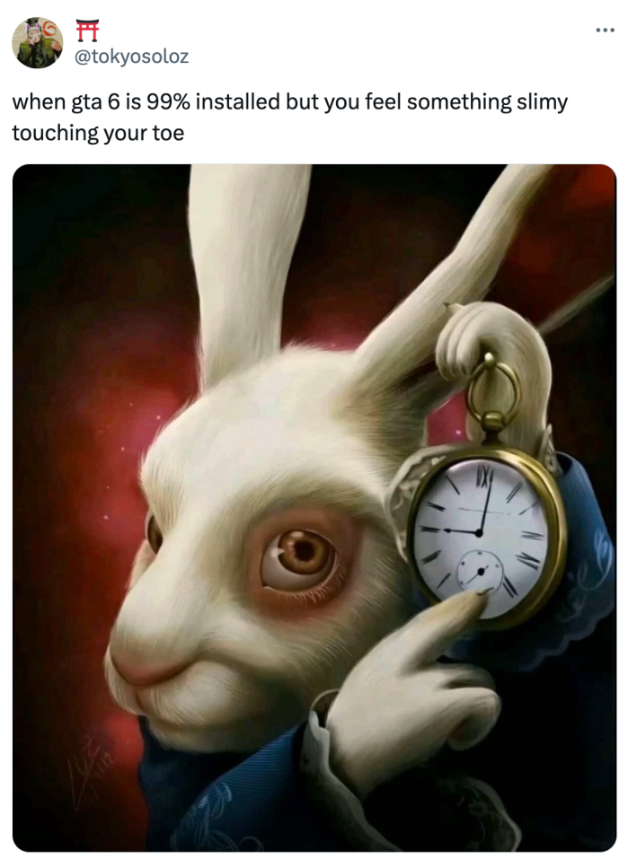 White rabbit pointing at clock meme that reads, "when gta 6 is 99% installed but you feel something slimy touching your toe"