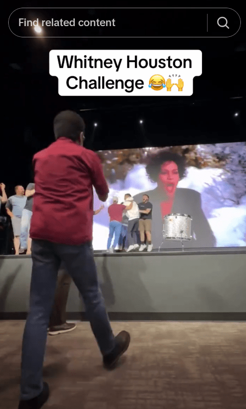 People cheering during a live Whitney Houston Challenge.