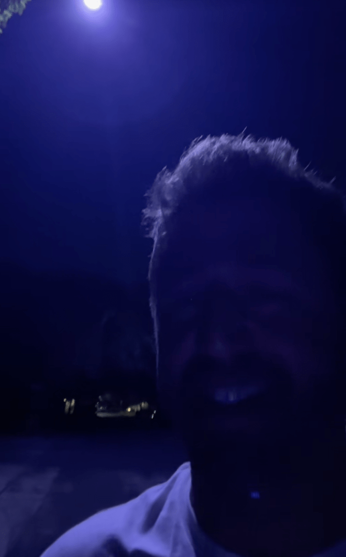 @evanlovett/TikTok under bluish purple streetlight at night