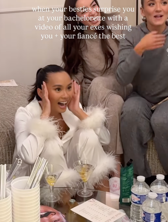 surprised bride laughing at bachelorette party with onscreen text: "when your besties surprise you at your bachelorette with a video of all your exes wishing you and your fiance the best…”