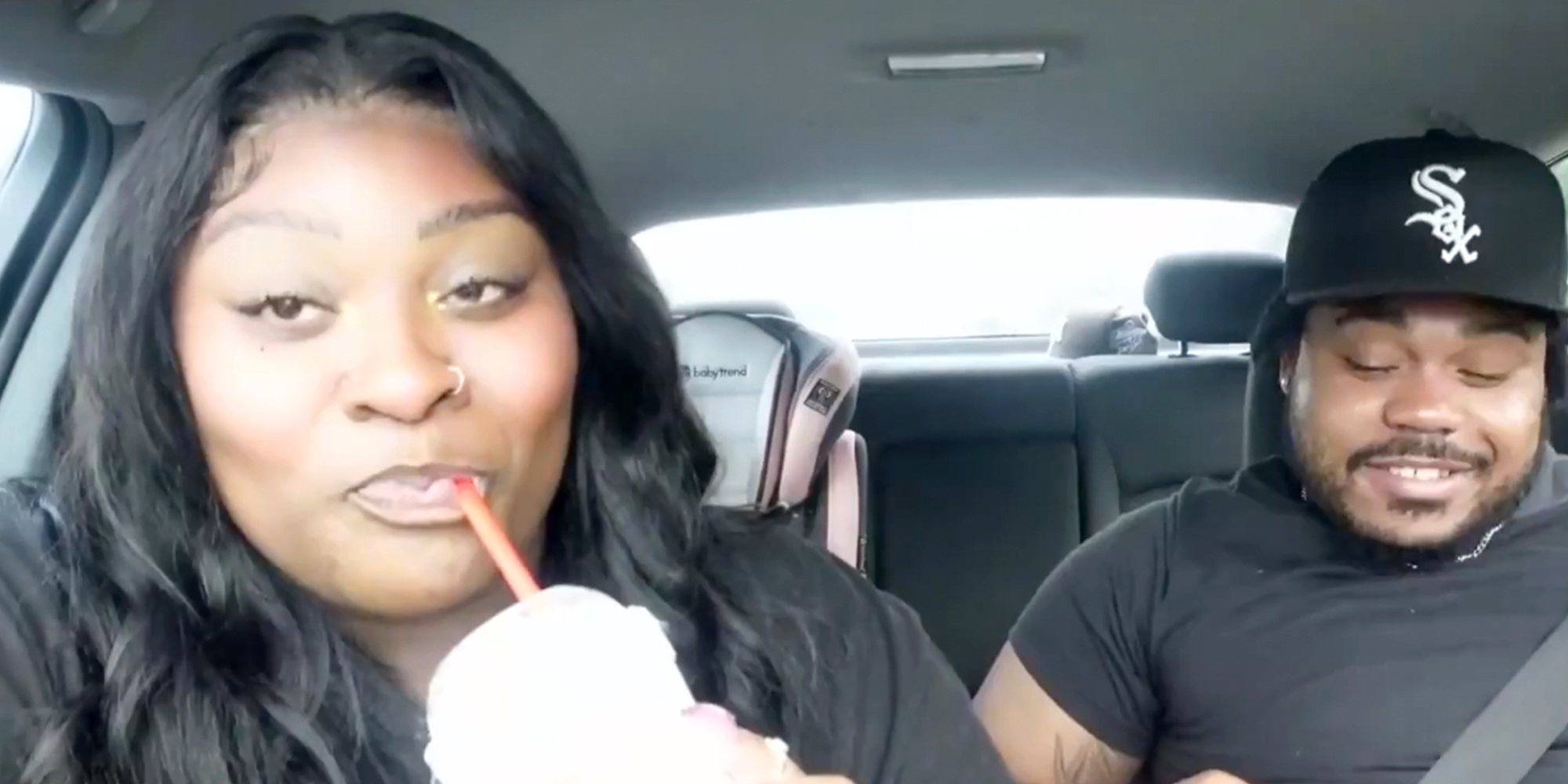 Influencer Brenay Kennard sipping on a soda in the car.