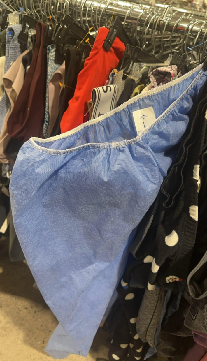 u/arleneofarcadia via Reddit disposable scrubs on rack at goodwill