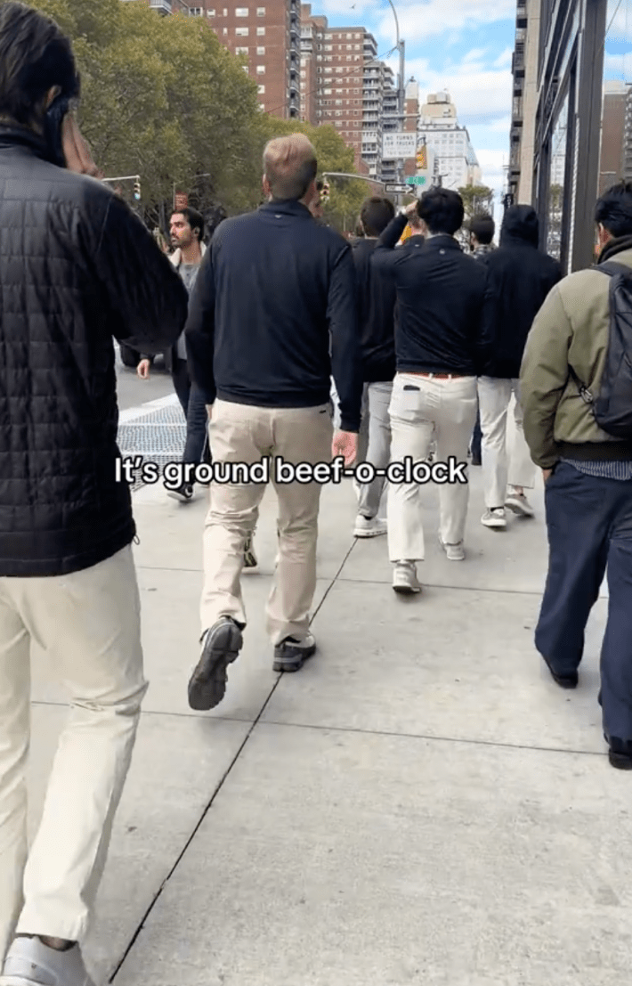 finance bros walking on the street with onscreen text: it's ground beef o clock