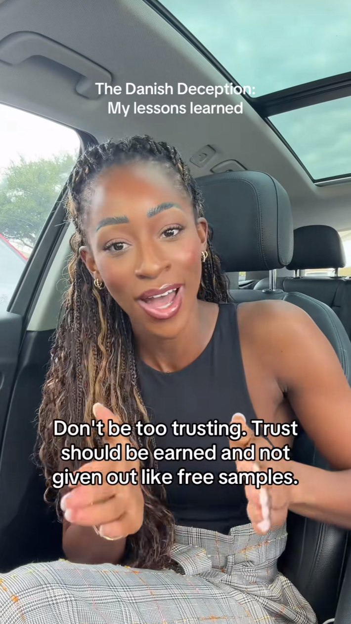 Onyeka sitting in her car talking about the lessons she learned from her experience.