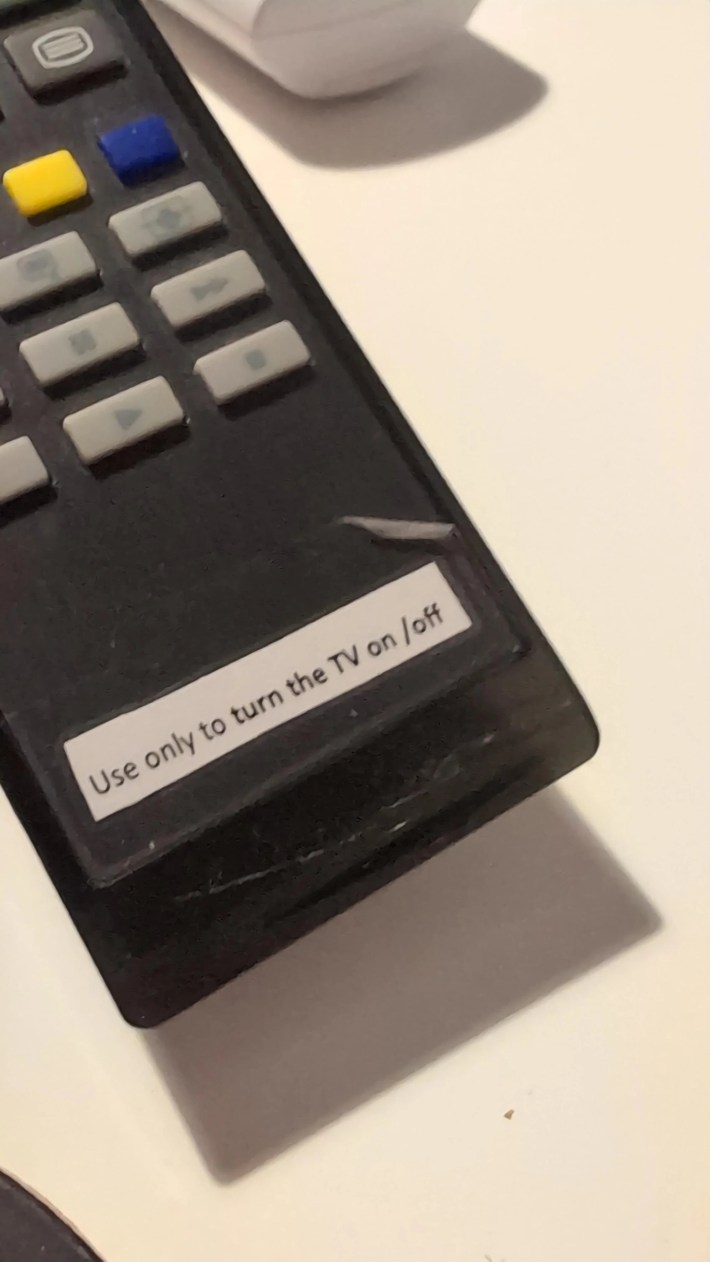 Photo of an old TV remote with a label at the bottom reading "Use only to turn the TV on/off."