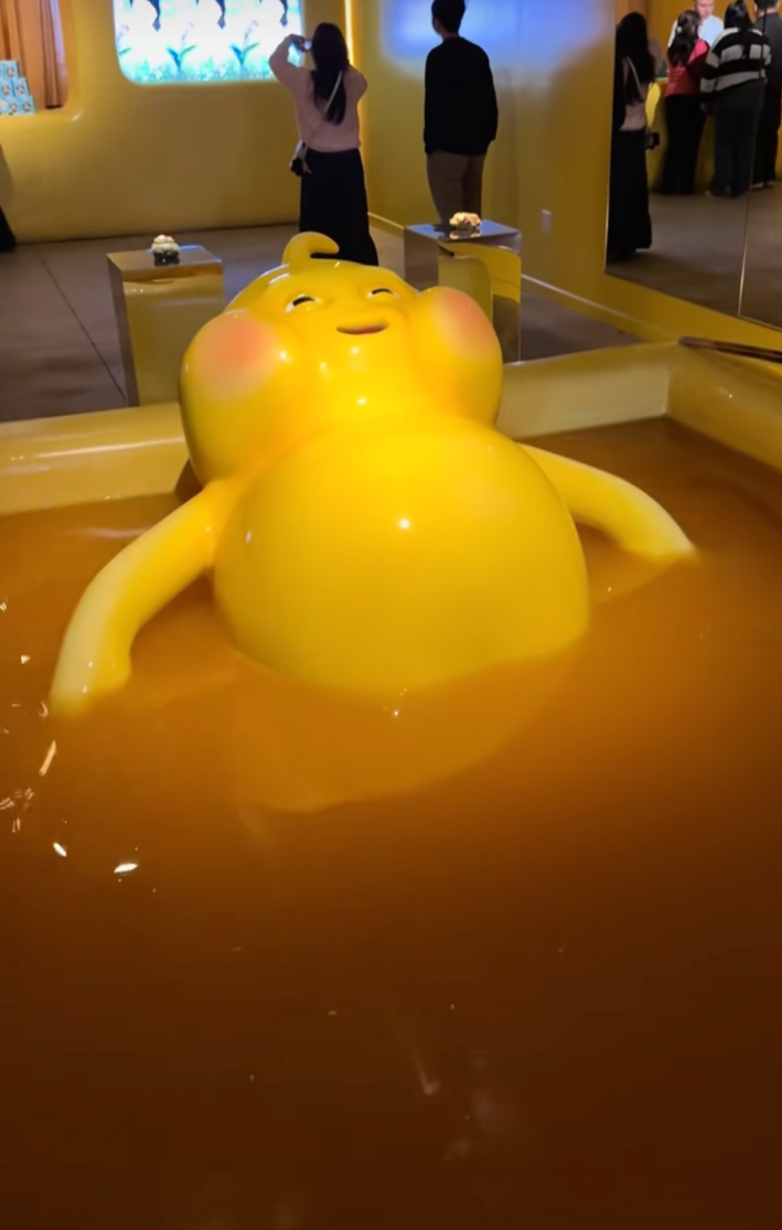 @christainamerica/TikTok, Butter Baby mascot bathing in a pool filled with butter
