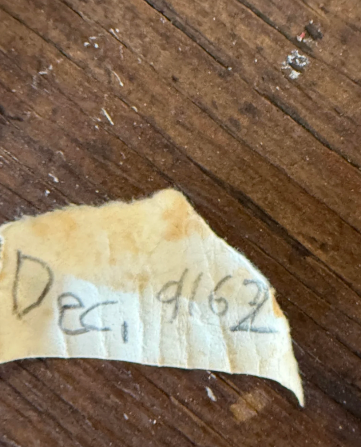 u/ashleygee via Reddit note from bauble that reads Dec. 9162, misspelling 1962.
