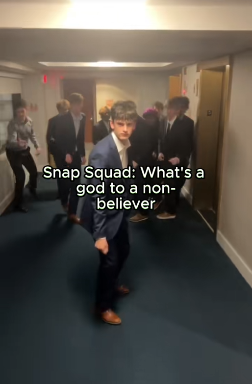 TikTok video of a group of young men doing the snap and step thing from Grease with a caption reading "Snap Squad: What's a god to a non-believer"