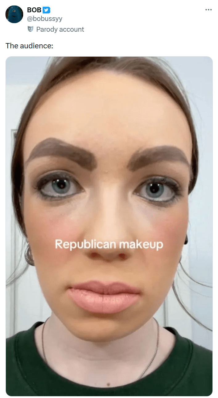 Tweet that reads, "The audience:" with a selfie of a woman wearing purposely-bad "Republican woman" makeup .