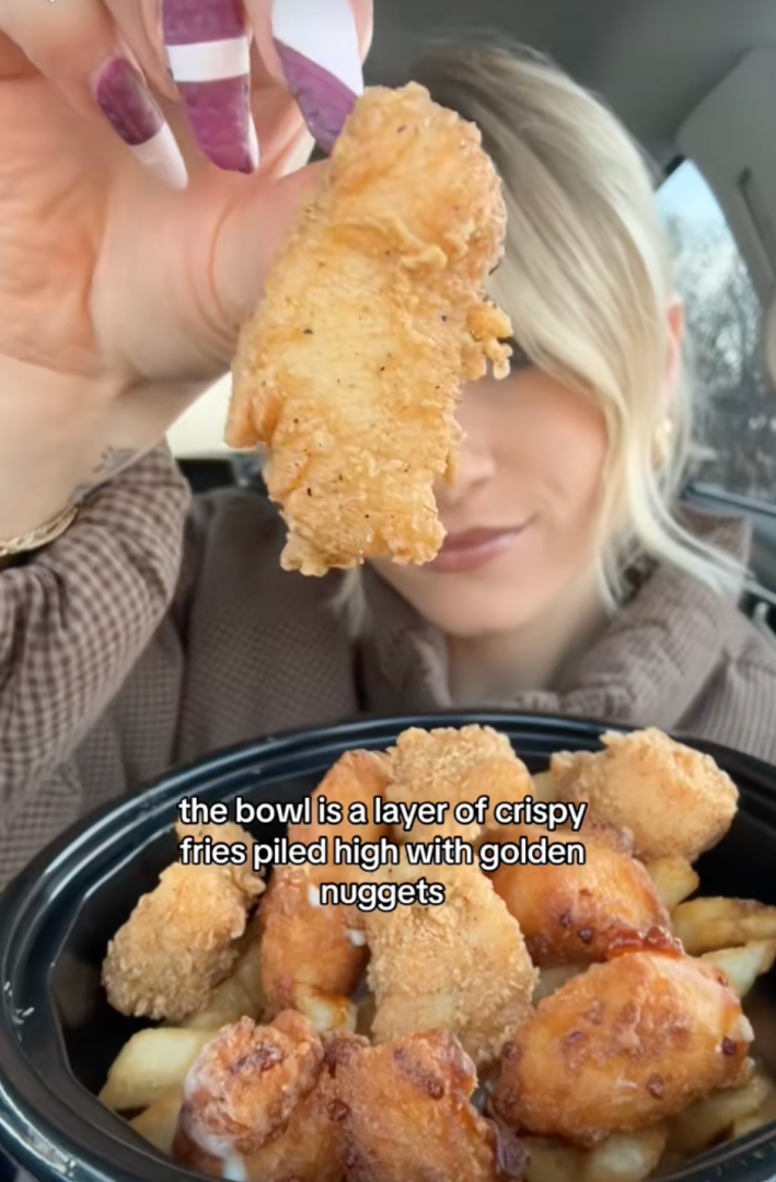 @eatsbynat/TikTok "the bowl is a layer of crispy fired piled high with golden nuggets" KFC's poutine bowl