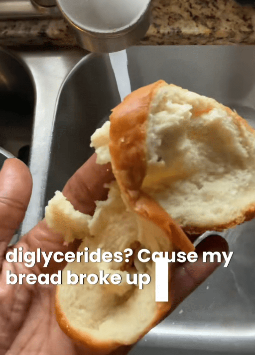 TikTok video showing a broken bread slice held over the sink with the water running.