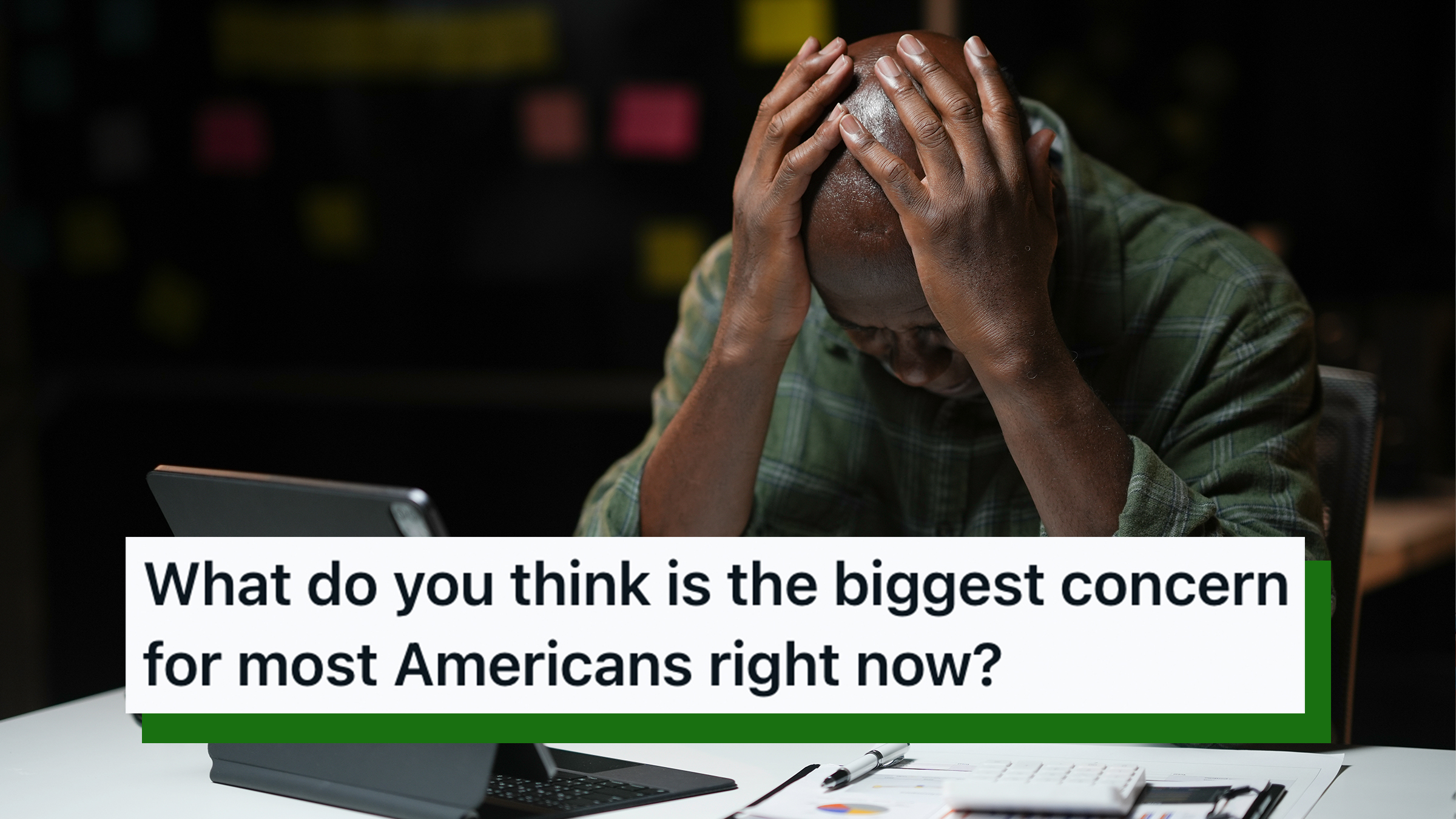 Businessman sitting in front of his iPad, holding his head in his hands, feeling stressed while working late at night. Text overlay from AskReddit reads, "What do you think is the biggest concern for most Americans right now?"