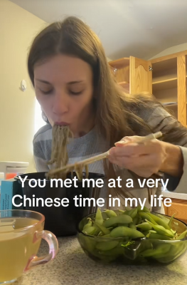 TikTok video of a woman eating noodles with a caption reading "You’ve met me at a very Chinese time in my life."