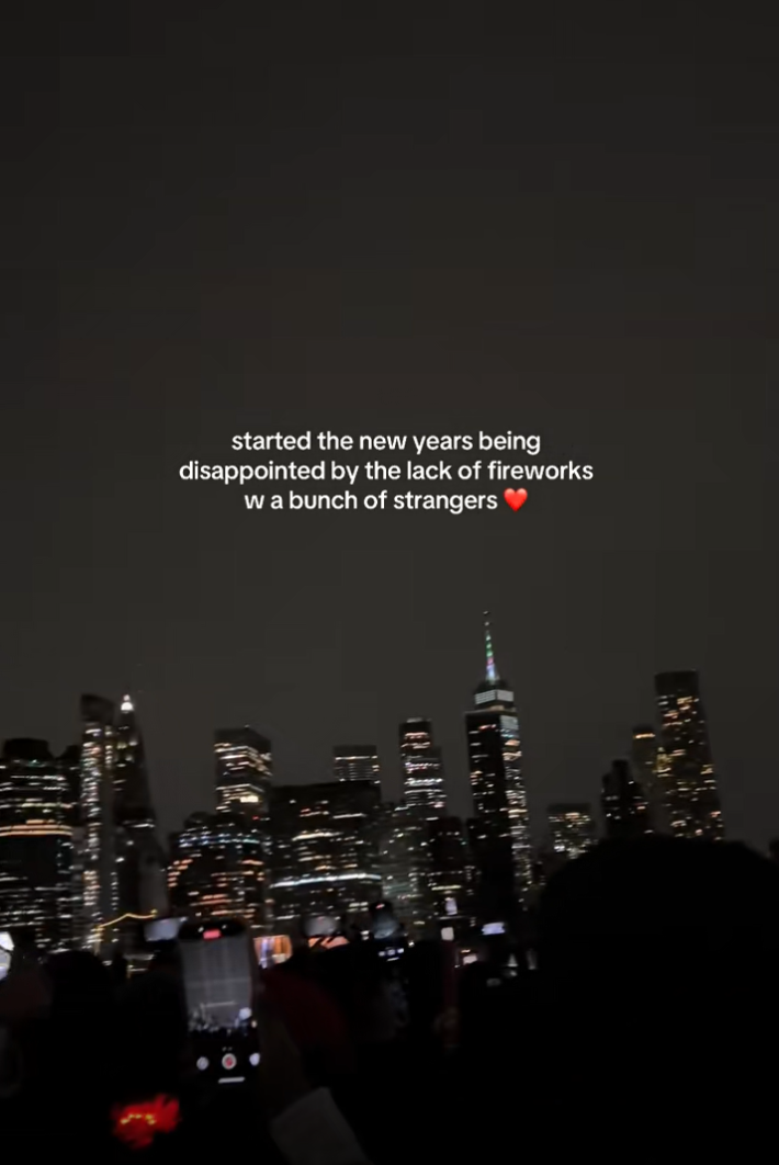 Cloudy night sky video from Brooklyn. Text overlay reads, "started the new years being disappointed by the lack of fireworks [with] a bunch of strangers"