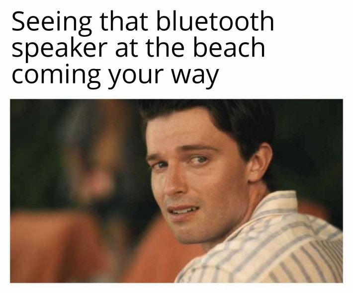 Saxon Looking Back meme from White Lotus. Text reads, "Seeing that bluetooth speaker at the beach coming your way."