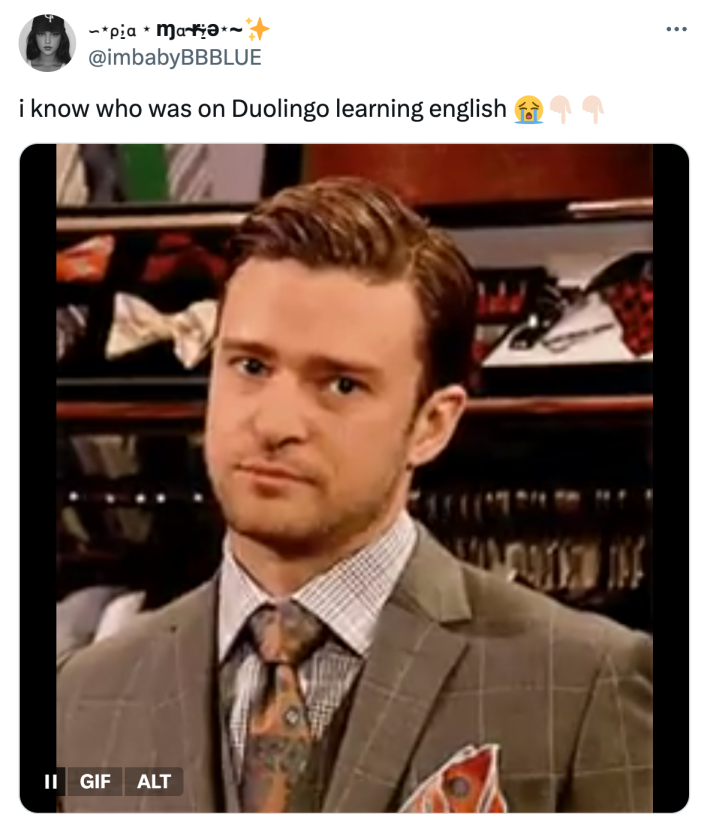 Tweet that reads, "i know who was on Duolingo learning english 😭👇🏻👇🏻"  with a GIF of Justin Timberlake staring down the camera with a knowing deadpan expression.