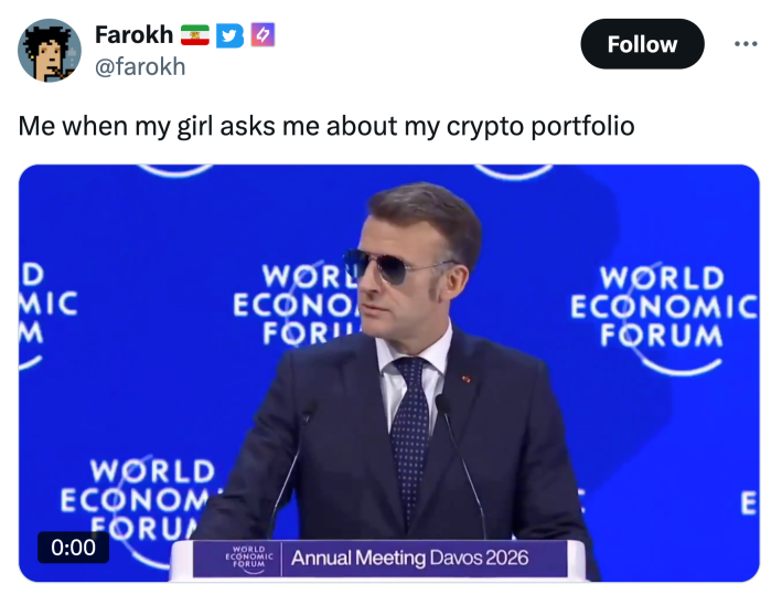 Tweet that reads, "Me when my girl asks me about my crypto portfolio" with a video of Macron giving a speech at the World Economic Forum.