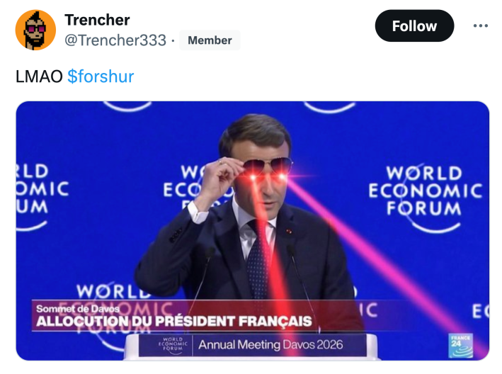 Tweet that reads, "LMAO" with an edited image of Macron giving a speech at the World Economic Forum but shooting lasers out of his eyes.
