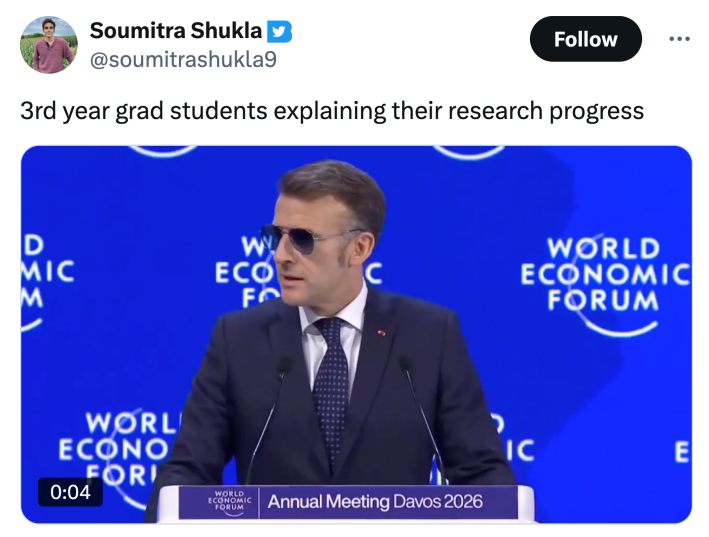 Tweet that reads, "3rd year grad students explaining their research progress" with a video of Macron giving a speech at the World Economic Forum.