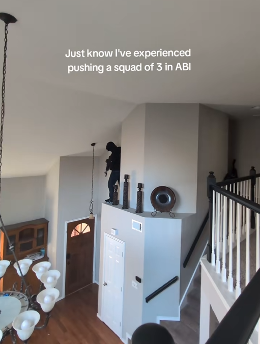 Nastiest angle TikTok video showing someone perched above their front door with a gun.
