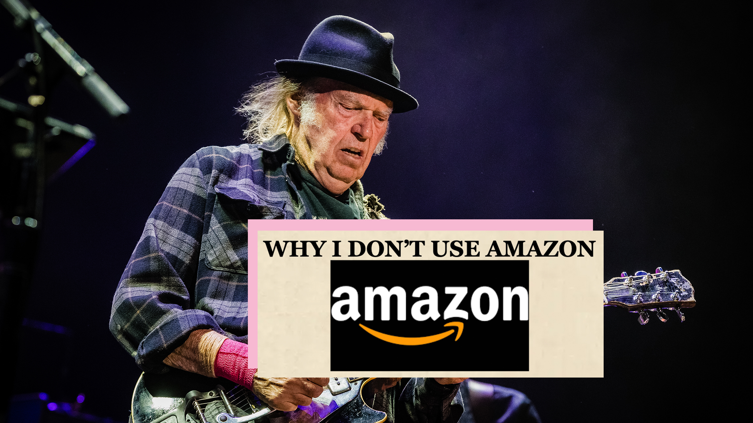 Neil Young performing at the Ziggo Dome in Amsterdam, The Netherlands in 2019. Screenshot overlay from his blog reads, "Why I don't use Amazon."