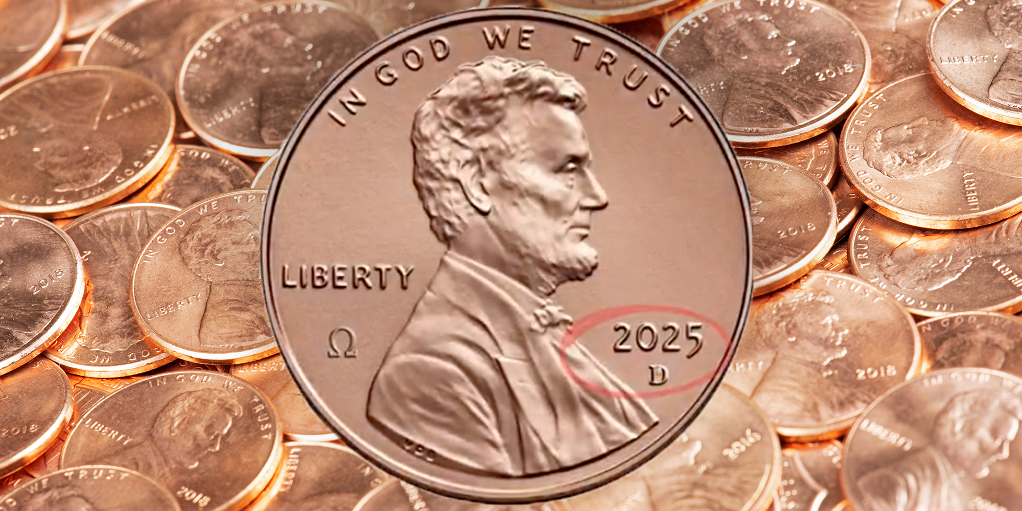 A 2025 minted U.S. penny against a Background of United States penny Coins Close up