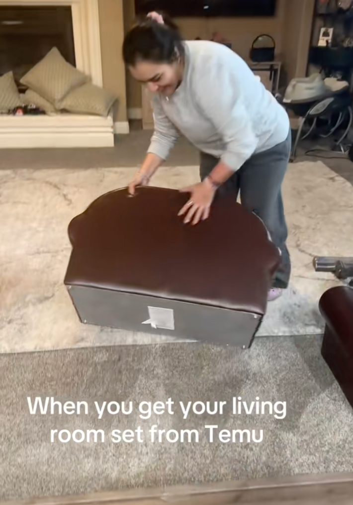 @josuemtz27/TikTok woman setting up tiny couch with on screen text: "when you get your living room set from Temu"