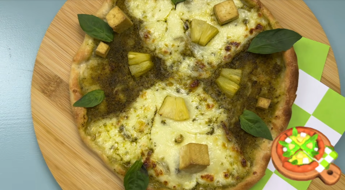 pineapple pizza with pesto and basil