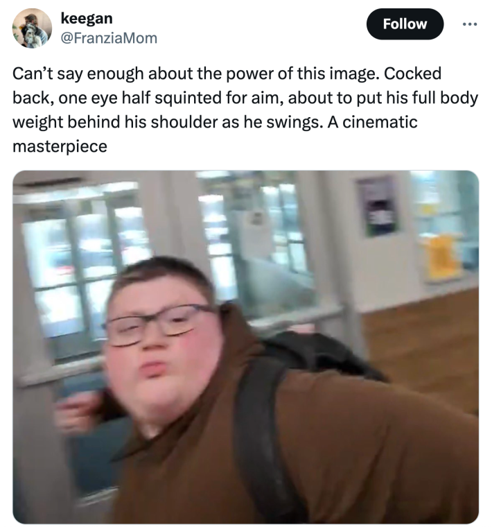 Brown hoodie kid punching meme. text reads, "Can’t say enough about the power of this image. Cocked back, one eye half squinted for aim, about to put his full body weight behind his shoulder as he swings. A cinematic masterpiece"