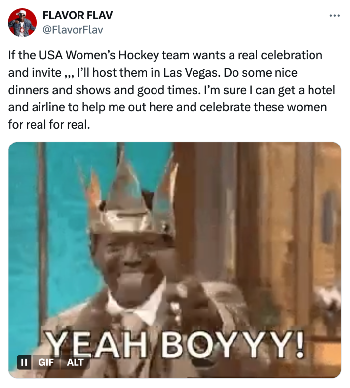 Tweet from Flavor Flav that reads, "If the USA Womenâs Hockey team wants a real celebration and invite ,,, Iâll host them in Las Vegas. Do some nice dinners and shows and good times. Iâm sure I can get a hotel and airline to help me out here and celebrate these women for real for real." with a GIF of himself in a gold crown saying, "YEAH BOYYY!"