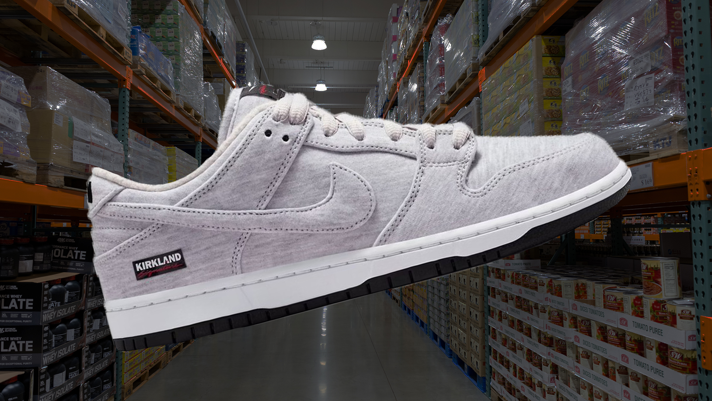 Kirkland Signature x Nike SB Dunk Low Pro QS sneaker. Background is the interior of a Costco store.