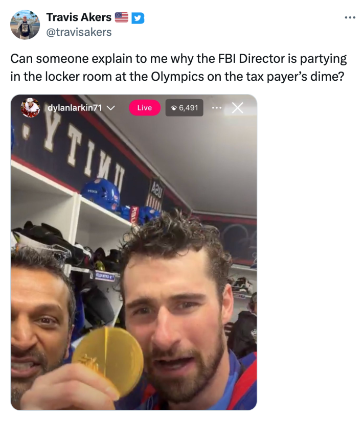 Tweet that reads, "Can someone explain to me why the FBI Director is partying in the locker room at the Olympics on the tax payer’s dime?" with a still from a video of him with one of the men's hockey players holding up his gold medal.