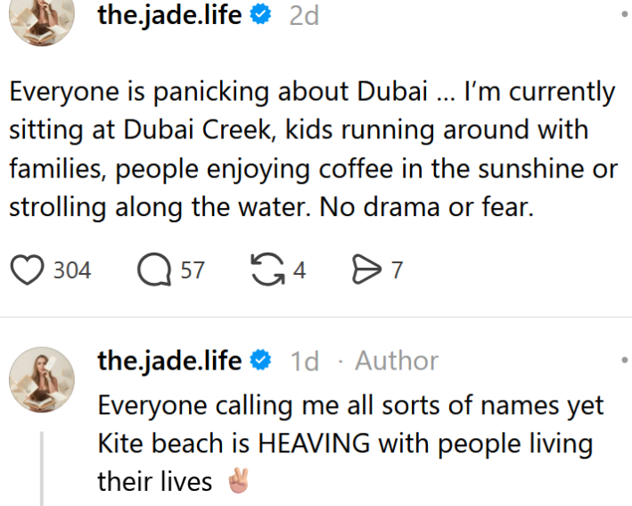 Threads post reading "Everyone is panicking about Dubai … I’m currently sitting at Dubai Creek, kids running around with families, people enjoying coffee in the sunshine or strolling along the water. No drama or fear." An OP reply reads "Everyone calling me all sorts of names yet Kite beach is HEAVING with people living their lives"