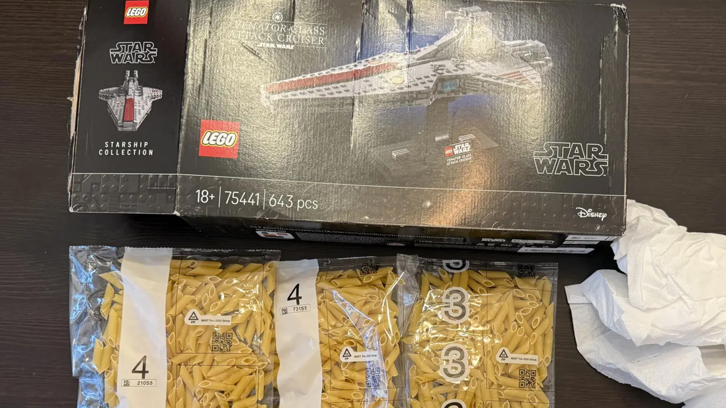 Star Wars Lego set box above bags of dry pasta in numbered plastic bags.