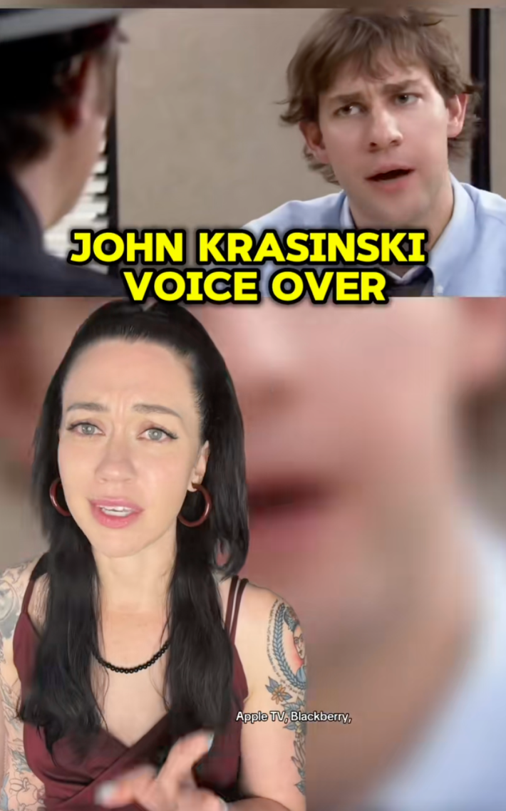 Screenshot of a woman with arm sleeve tattoos and her black hair pulled back in a half-updo. On a greenscreen behind her is Jim from The Office looking confused. Text overlay reads, "John Krasinski voice over."