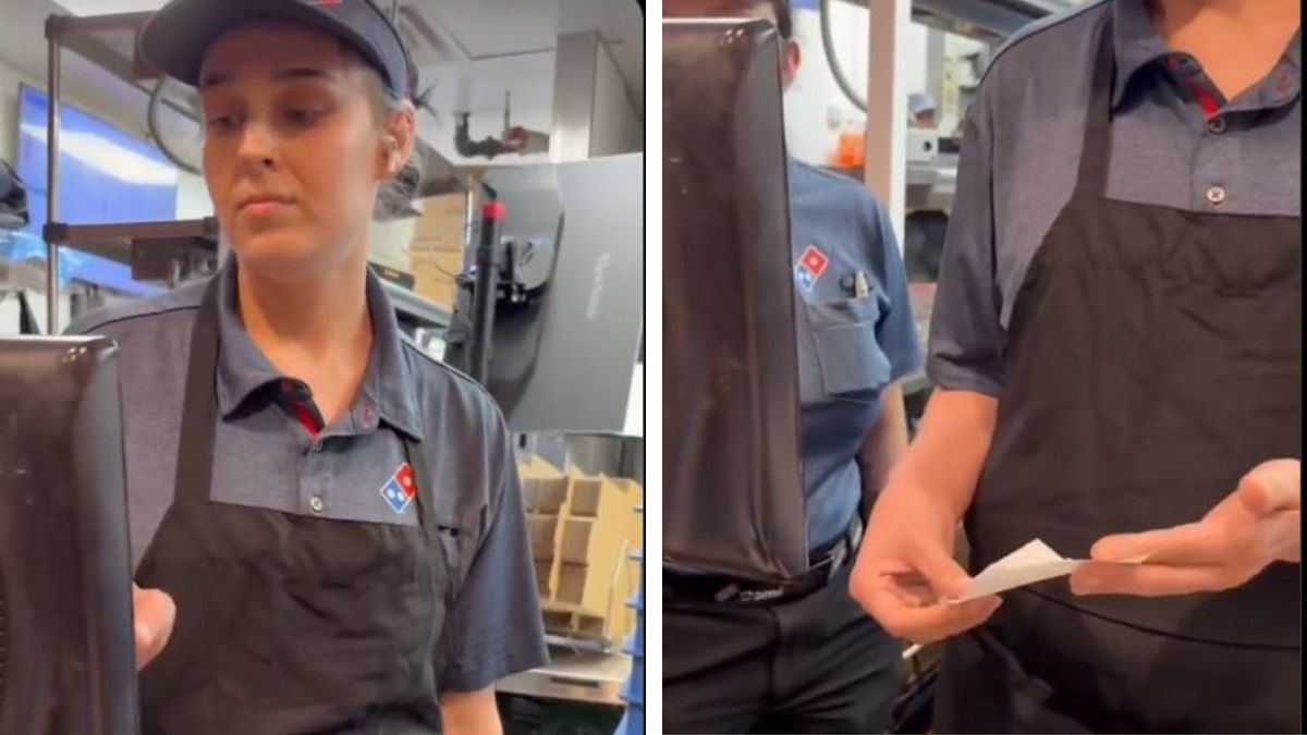 Domino's employee at a counter while customers hold a receipt