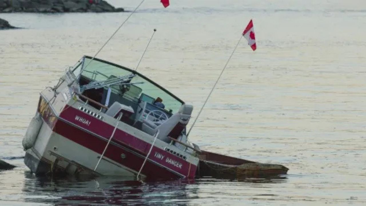 Small boat sinking in the water.