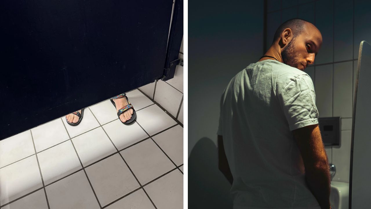 Someone standing immediately outside an occupied bathroom stall.