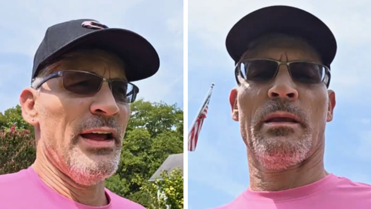 A self-described veteran stands in front of an American flag.