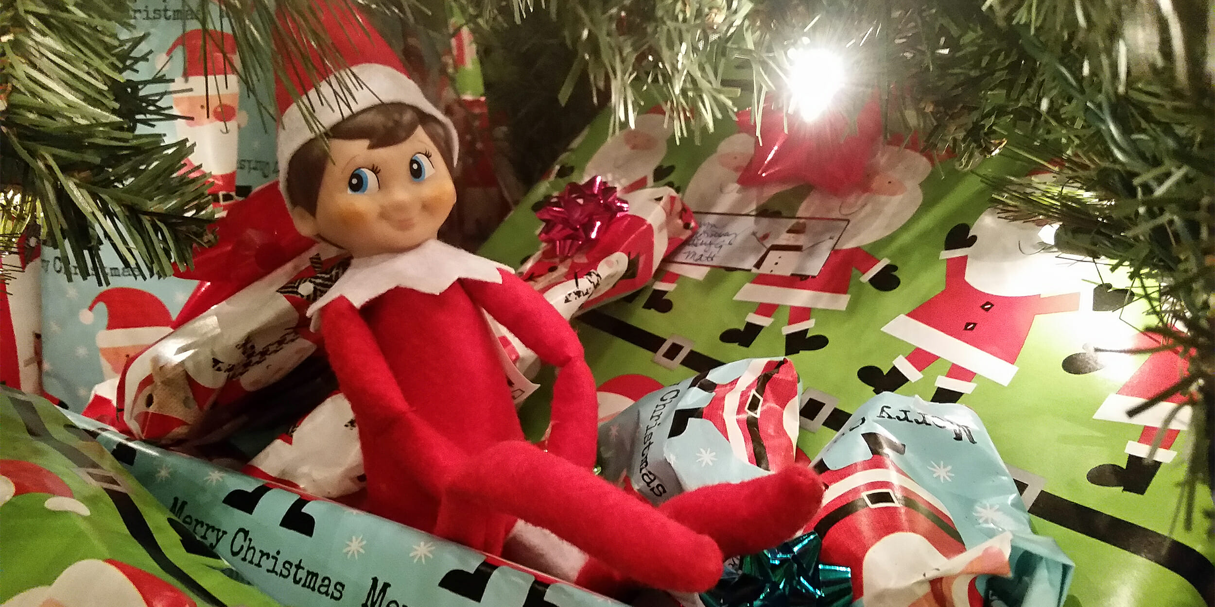 Elf on the Shelf under Christmas tree