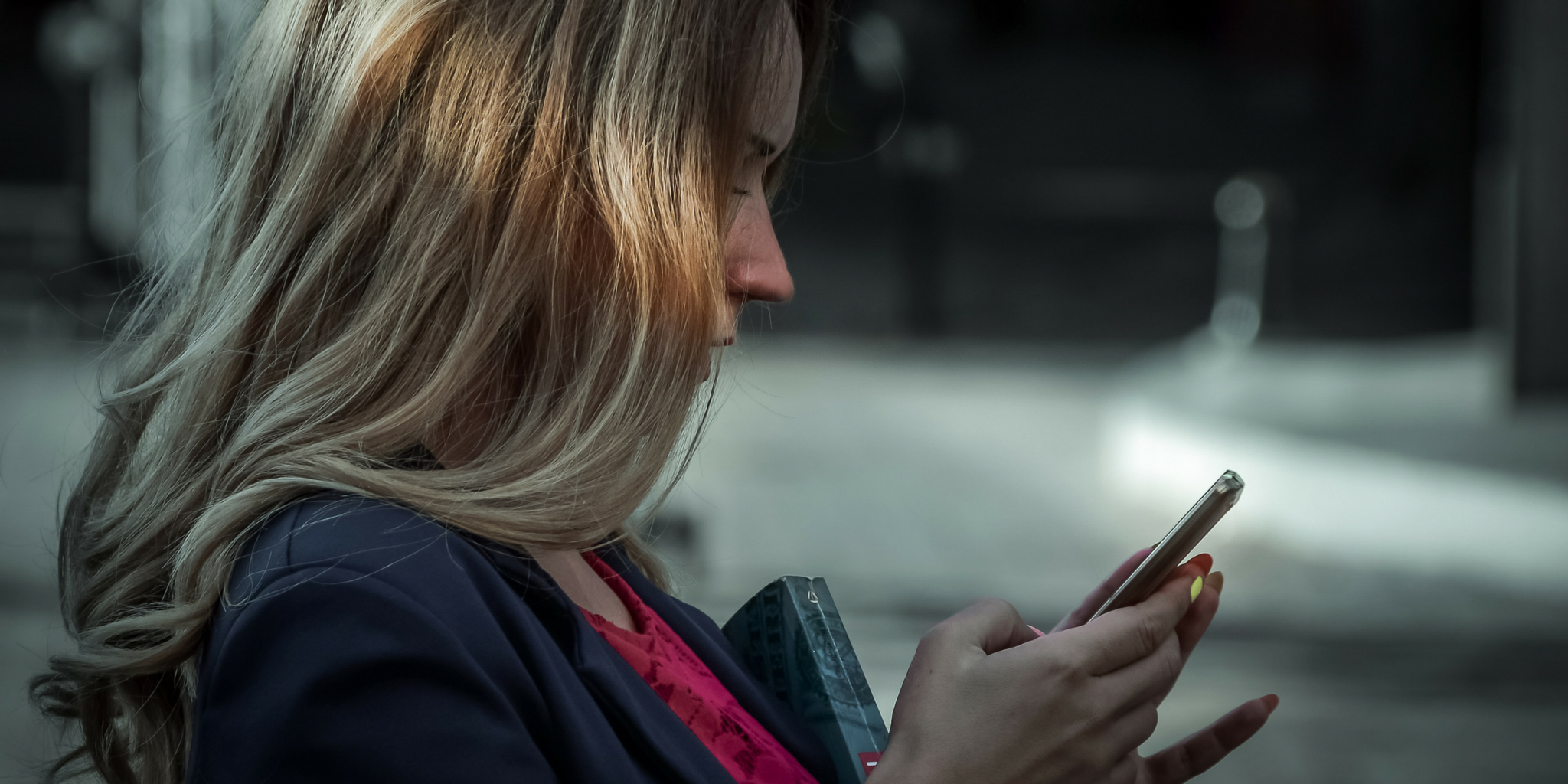 A woman looking at her phone