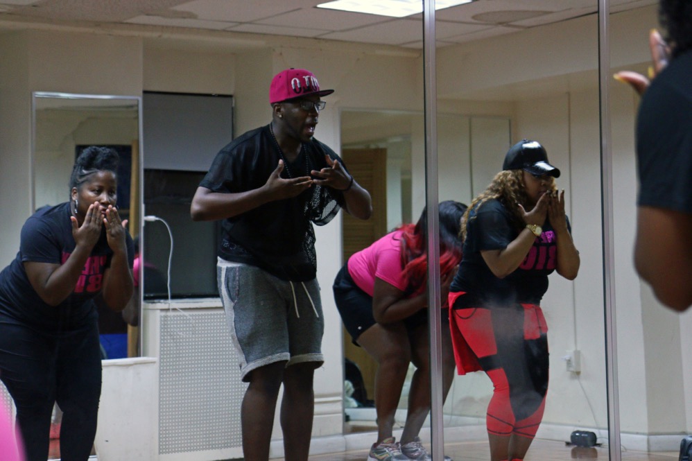 Yancy shows Pretty Big Movement dancers the moves to Lady Leshurr's "Brush Your Teeth."